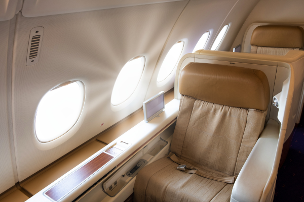 Spacious and luxurious business class airplane seat with premium amenities