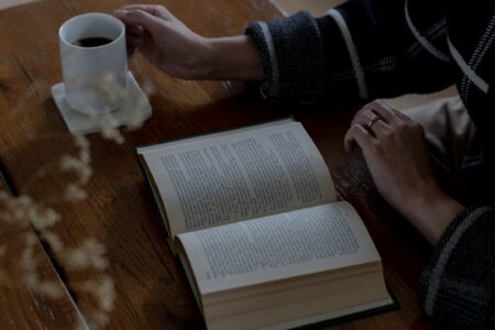 Business traveller walking at sunrise, framed by architecture, representing preparation, awareness, and knowledge as confidence tools